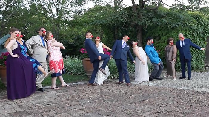 Tuscany wedding videographer: The bride and groom doing a funny photo with their guests Tuscany wedding videographer: The bride and groom doing a funny photo with their guests